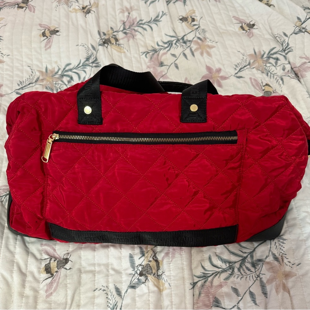 Red quilted Steve Madden weekender duffel bag
